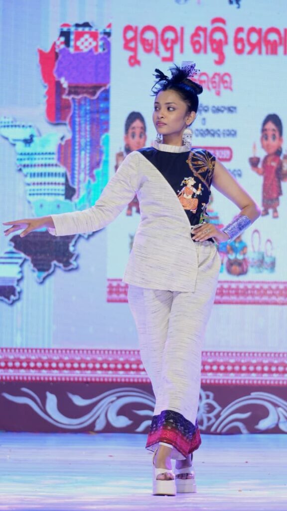 Titikshya Dhurua walking the ramp with Mission Dreams at Shubhadra Shakti Mela fashion showcase